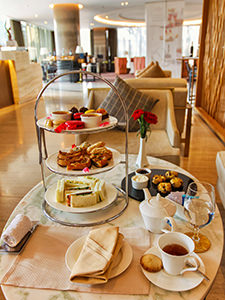 Three-tiered afternoon tea set with savoury and sweet delights in the Elephant Lounge of Crowne Plaza Vientiane, 5 star hotel in Laos capital, photo by Ivan Kralj
