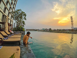 Swimming pool at Crowne Plaza Vientiane, 5 star hotel in Laos capital, during sunset, photo by Ivan Kralj