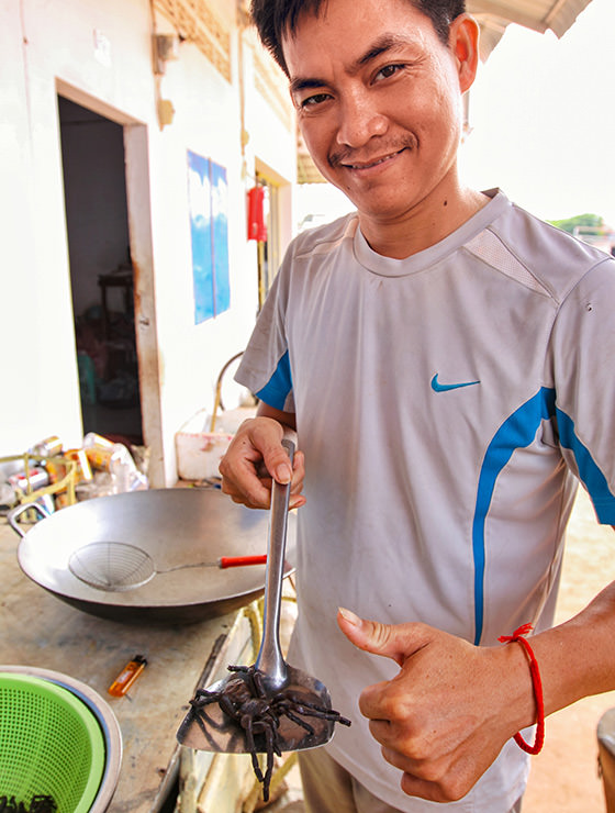 Experience host Ratana Ouch showing the tarantula spider at Backstreet Academy's Fear Factor Challenge cooking class in Siem Reap, Cambodia, a country where they love eating insects, photo by Ivan Kralj