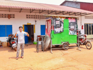 Ratana Ouch standing in front of his house where he teaches people how to eat insects in Backstreet Academy's Fear Factor Challenge, in Siem Reap, Cambodia, photo by Ivan Kralj