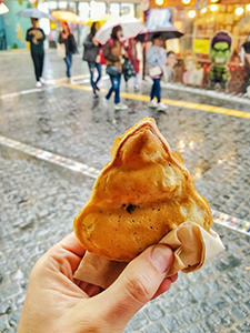 Ttongppang is a stylized feces-shaped pastry filled with sweetened red beans paste, a street food dessert in Seoul, South Korea, photo by Ivan Kralj