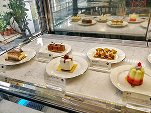 Cakes displayed in a vitrine at Unas, a dessert cafe in Seoul, South Korea, photo by Ivan Kralj