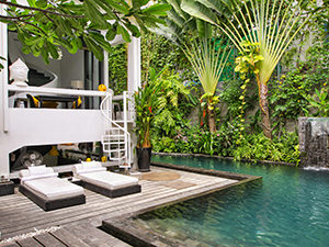 Exterior of Arthur & Paul hotel in Phnom Penh, Cambodia,, with swimming pool, sun loungers, tropical plants and beautiful architecture, photo by Ivan Kralj