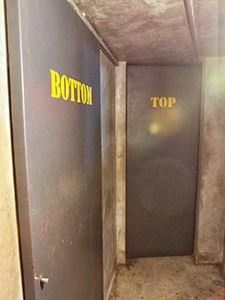 Doors of the private cabins in Arthur & Paul spa in Phnom Penh, Cambodia, marked with the words "bottom" and "top"
