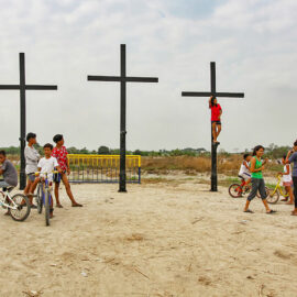 Children posing next to the crosses that will be a central point of the crucifiction in Pampanga, San Fernando, San Pedro Cutud, during Maleldo 2019, the Holy Week Philippines, photo by Ivan Kralj