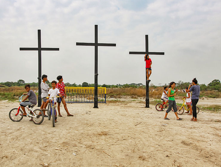 Children posing next to the crosses that will be a central point of the crucifiction in Pampanga, San Fernando, San Pedro Cutud, during Maleldo 2019, the Holy Week Philippines, photo by Ivan Kralj
