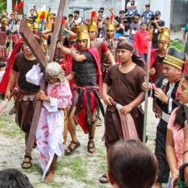 Wilfredo Salvador (62) carrying a wooden cross before going through the crucifixion in Pampanga, San Fernando, the baray of San Juan, which is one of the highlights of the Maleldo 2019, Holy Week Philippines, photo by Ivan Kralj
