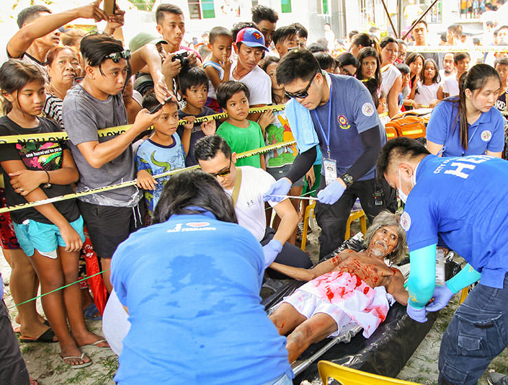 Wilfredo Salvador (62) being treated by the medical team after the crucifixion in Pampanga, San Fernando, the baray of San Juan, which is one of the highlights of the Maleldo 2019, Holy Week Philippines, photo by Ivan Kralj