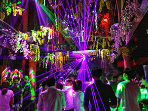 People dancing under the light show in the Heart of Darkness, Phnom Penh's iconic night club, Cambodia, photo by Ivan Kralj