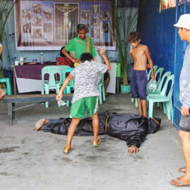 Magdarame devotees relive Christ's passion by carrying heavy crosses and flagellating themselves in San Fernando, Pampanga, during the Maleldo 2019, Holy Week Philippines, photo by Ivan Kralj