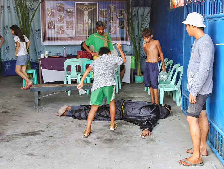 Magdarame devotees relive Christ's passion by carrying heavy crosses and flagellating themselves in San Fernando, Pampanga, during the Maleldo 2019, Holy Week Philippines, photo by Ivan Kralj