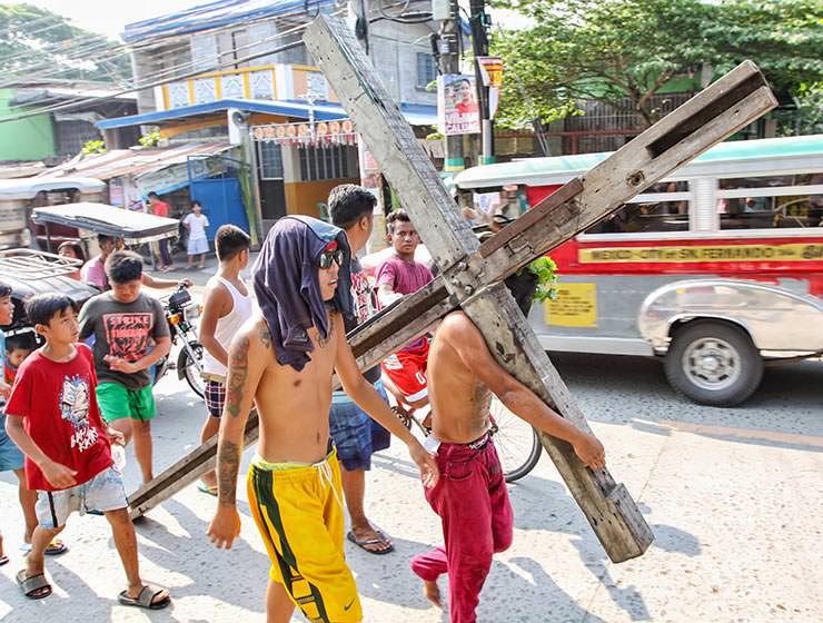 Magdarame devotees relive Christ's passion by carrying heavy crosses and flagellating themselves in San Fernando, Pampanga, during the Maleldo 2019, Holy Week Philippines, photo by Ivan Kralj