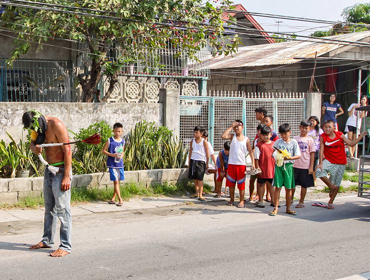 Magdarame devotees relive Christ's passion by carrying heavy crosses and flagellating themselves in San Fernando, Pampanga, during the Maleldo 2019, Holy Week Philippines, photo by Ivan Kralj
