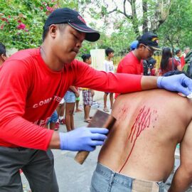 Magdarame devotees relive Christ's passion by carrying heavy crosses and flagellating themselves in San Fernando, Pampanga, during the Maleldo 2019, Holy Week Philippines, photo by Ivan Kralj