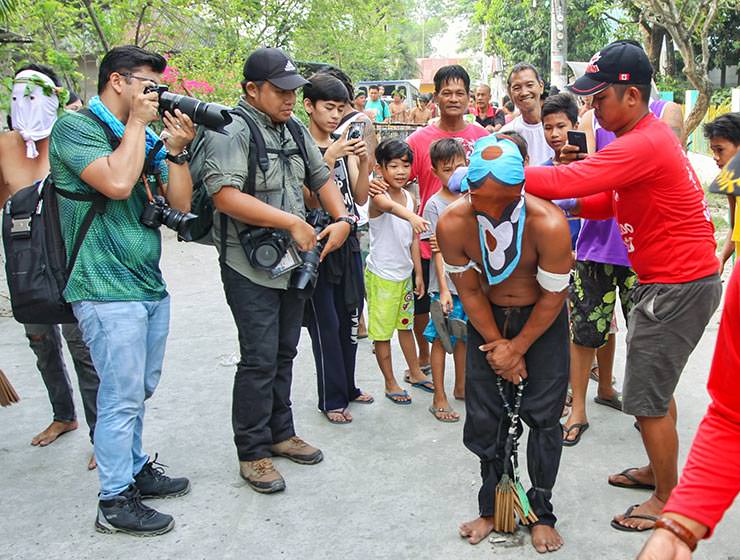 Magdarame devotees relive Christ's passion by carrying heavy crosses and flagellating themselves in San Fernando, Pampanga, during the Maleldo 2019, Holy Week Philippines, photo by Ivan Kralj