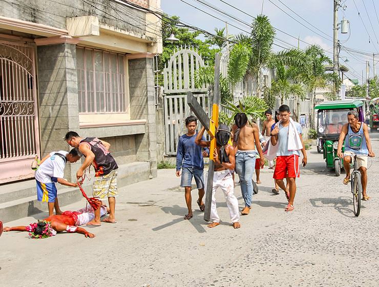 Magdarame devotees relive Christ's passion by carrying heavy crosses and flagellating themselves in San Fernando, Pampanga, during the Maleldo 2019, Holy Week Philippines, photo by Ivan Kralj