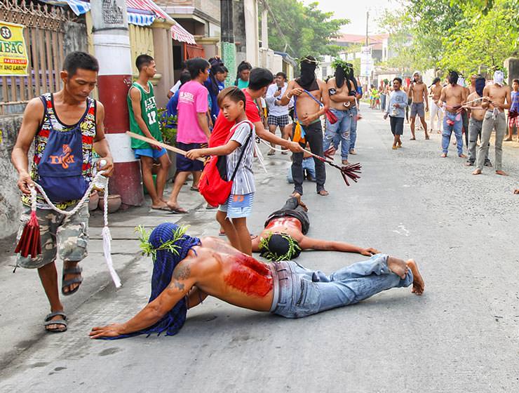 Magdarame devotees relive Christ's passion by carrying heavy crosses and flagellating themselves in San Fernando, Pampanga, during the Maleldo 2019, Holy Week Philippines, photo by Ivan Kralj