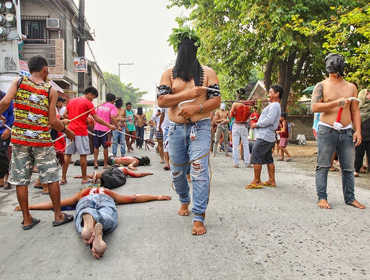 Magdarame devotees relive Christ's passion by carrying heavy crosses and flagellating themselves in San Fernando, Pampanga, during the Maleldo 2019, Holy Week Philippines, photo by Ivan Kralj