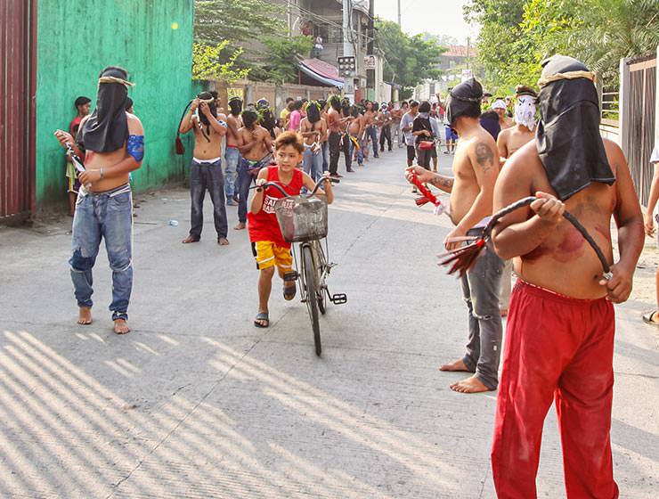 Magdarame devotees relive Christ's passion by carrying heavy crosses and flagellating themselves in San Fernando, Pampanga, during the Maleldo 2019, Holy Week Philippines, photo by Ivan Kralj