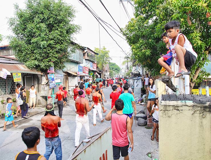 Magdarame devotees relive Christ's passion by carrying heavy crosses and flagellating themselves in San Fernando, Pampanga, during the Maleldo 2019, Holy Week Philippines, photo by Ivan Kralj
