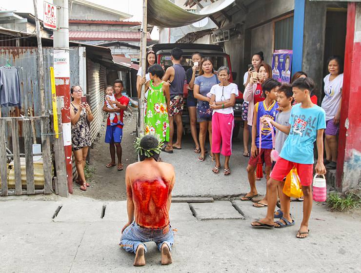 Magdarame devotees relive Christ's passion by carrying heavy crosses and flagellating themselves in San Fernando, Pampanga, during the Maleldo 2019, Holy Week Philippines, photo by Ivan Kralj