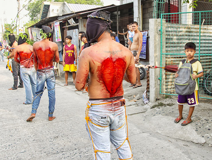 Magdarame devotees relive Christ's passion by carrying heavy crosses and flagellating themselves in San Fernando, Pampanga, during the Maleldo Festival, Holy Week Philippines, photo by Ivan Kralj