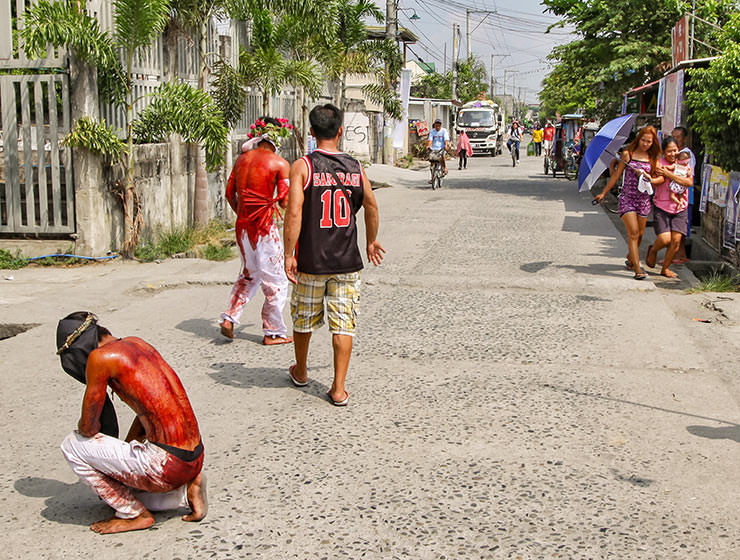 Magdarame devotees relive Christ's passion by carrying heavy crosses and flagellating themselves in San Fernando, Pampanga, during the Maleldo 2019, Holy Week Philippines, photo by Ivan Kralj