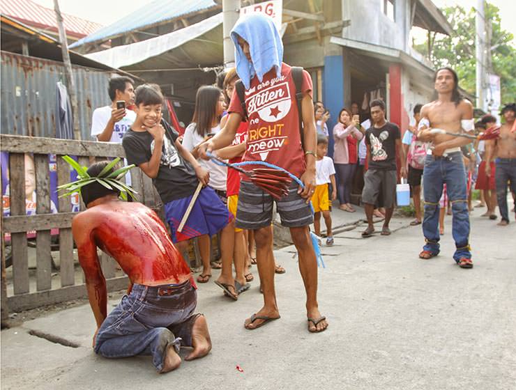 Magdarame devotees relive Christ's passion by carrying heavy crosses and flagellating themselves in San Fernando, Pampanga, during the Maleldo 2019, Holy Week Philippines, photo by Ivan Kralj