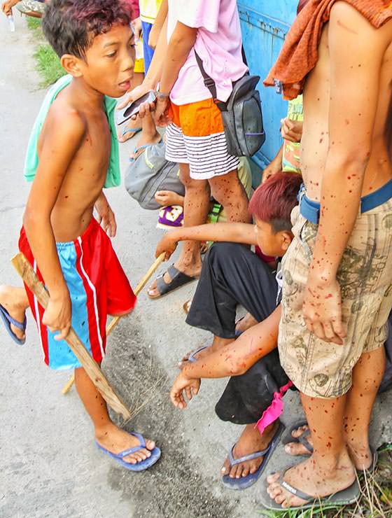 Kids covered in blood in the streets of San Fernando. Magdarame devotees relive Christ's passion by carrying heavy crosses and flagellating themselves in San Fernando, Pampanga, during the Maleldo 2019, Holy Week Philippines, photo by Ivan Kralj