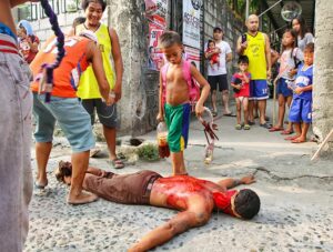 Magdarame devotees relive Christ's passion by carrying heavy crosses and flagellating themselves in San Fernando, Pampanga, during the Maleldo 2019, Holy Week Philippines, photo by Ivan Kralj