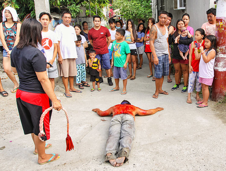 Magdarame devotees relive Christ's passion by carrying heavy crosses and flagellating themselves in San Fernando, Pampanga, during the Maleldo 2019, Holy Week Philippines, photo by Ivan Kralj