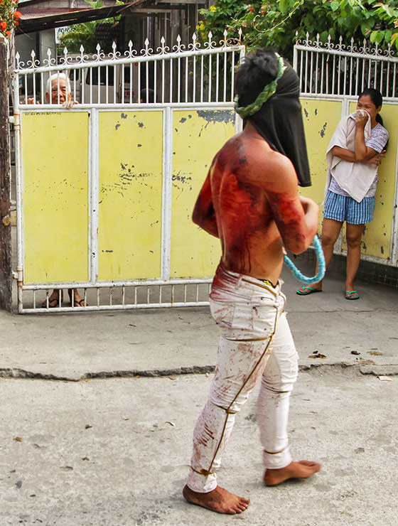 Magdarame devotees relive Christ's passion by carrying heavy crosses and flagellating themselves in San Fernando, Pampanga, during the Maleldo 2019, Holy Week Philippines, photo by Ivan Kralj