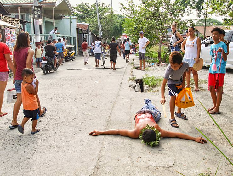 Magdarame devotees relive Christ's passion by carrying heavy crosses and flagellating themselves in San Fernando, Pampanga, during the Maleldo 2019, Holy Week Philippines, photo by Ivan Kralj