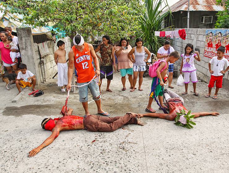 Magdarame devotees relive Christ's passion by carrying heavy crosses and flagellating themselves in San Fernando, Pampanga, during the Maleldo 2019, Holy Week Philippines, photo by Ivan Kralj