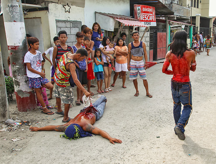 Magdarame devotees relive Christ's passion by carrying heavy crosses and flagellating themselves in San Fernando, Pampanga, during the Maleldo 2019, Holy Week Philippines, photo by Ivan Kralj