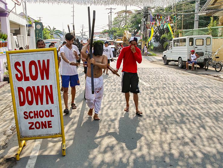 Magdarame devotees relive Christ's passion by carrying heavy crosses and flagellating themselves in San Fernando, Pampanga, during the Maleldo 2019, Holy Week Philippines, photo by Ivan Kralj