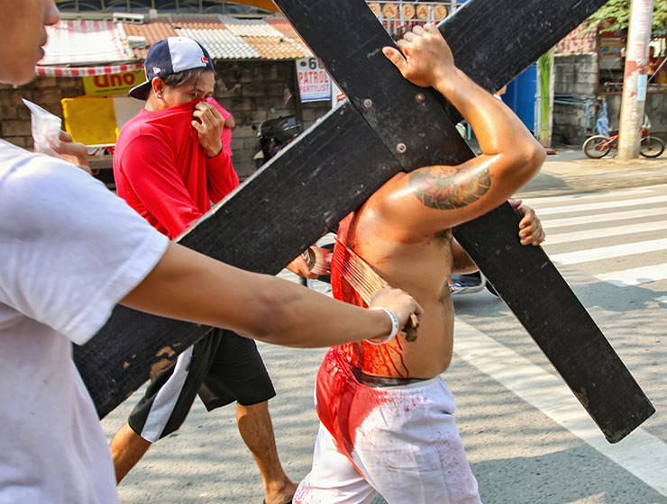Magdarame devotees relive Christ's passion by carrying heavy crosses and flagellating themselves in San Fernando, Pampanga, during the Maleldo 2019, Holy Week Philippines, photo by Ivan Kralj
