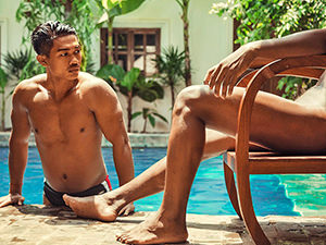 Young man getting out of the swimming pool, while the other one is sitting naked in the chair, a photograph for the Space Hair Salon and Bar's calendar Men of Cambodia 2018/2019.