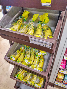 Bananas displayed in 7/11 store on Koh Samet island in Thailand, with each banana wrapped in its own plastic bag, photo by Ivan Kralj