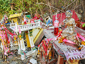 Spirit houses on Koh Samet island in Thailand; drinks offered to the spirits have plastic straws, photo by Ivan Kralj