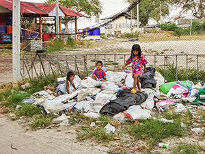 Children playing on the piles of trash on Koh Samet, so-called plastic-free island and a national park in Thailand, photo by Ivan Kralj