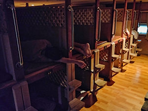 People sleeping in bunk beds in the sleeping area of Siloam Bulgama Sauna Spa, a Korean spa / jjimjilbang in Seoul, South Korea, photo by Ivan Kralj