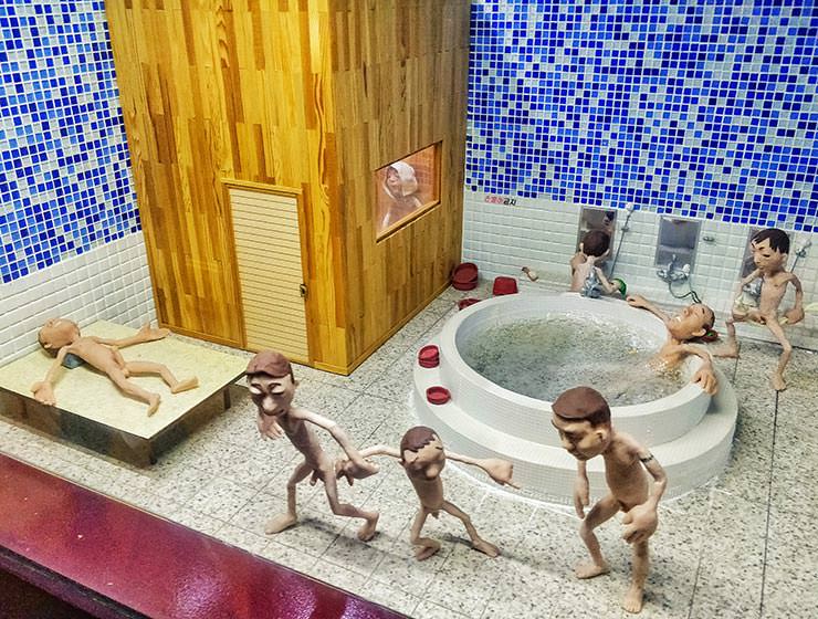 Asian bathhouse miniature: Korean spa or Jjimjilbang scene represented as a diorama in Loveland park on Jeju Island, South Korea, photo by Ivan Kralj