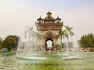 Patuxai victory arch behind the fountain, one of the top places to visit in Vientiane, Laos, photo by Ivan Kralj