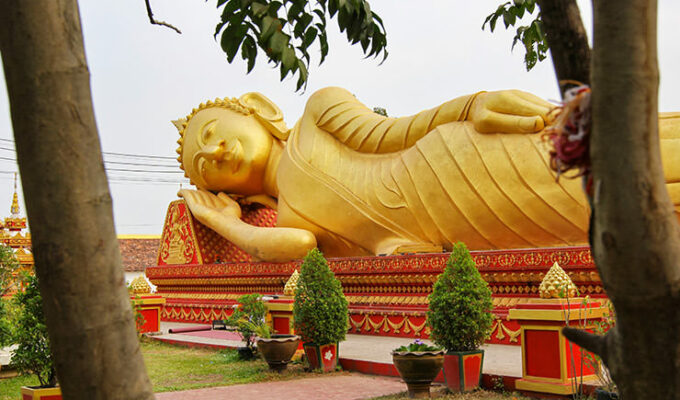 Reclining Buddha statue sleeping at That Luang Tai temple in Vientiane, the sleepy capital city of Laos; visiting this place is one of the top 20 best things to do in Vientiane, photo by Ivan Kralj