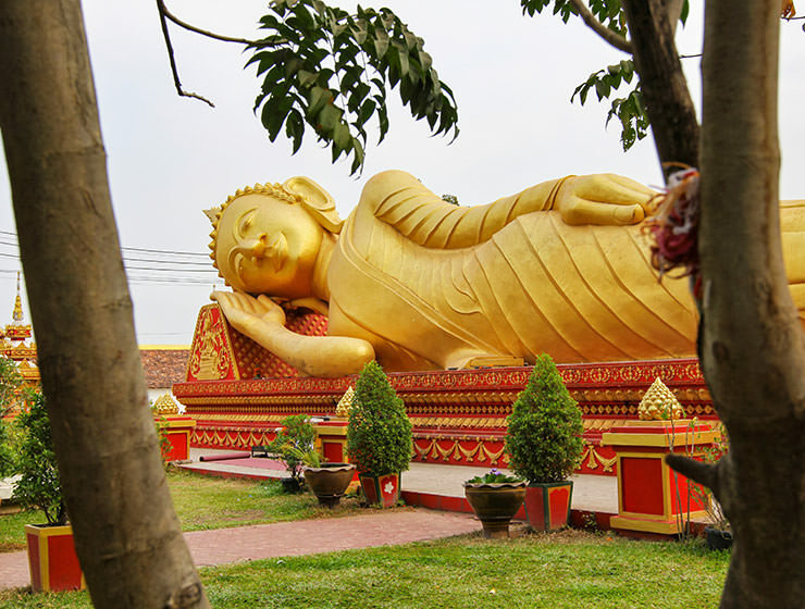 Reclining Buddha statue sleeping at That Luang Tai temple in Vientiane, the sleepy capital city of Laos; visiting this place is one of the top 20 best things to do in Vientiane, photo by Ivan Kralj