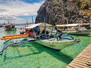 Okoy bangka by JY Travel and Tours parked on a docking place at Barracuda Lake, Coron Palawan, Philippines, photo by Ivan Kralj