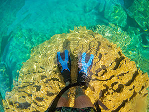 Standing in fins in the shallow waters of Barracuda Lake, Coron Island, Palawan, Philippines, photo by Ivan Kralj