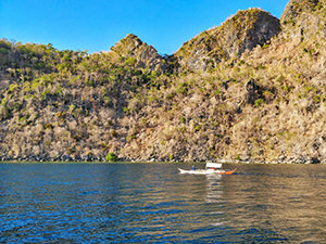 Boat passing by Coron Island, Palawan, Philippines, photo by Ivan Kralj