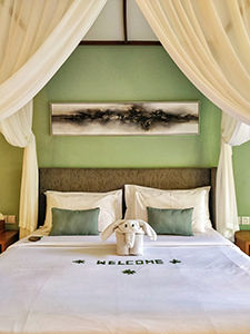 Welcome message and elephant-shaped towel on the bed in the villa at The Amala Estate, one of the best hotels in Bali, Indonesia, photo by Ivan Kralj